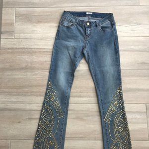 Brass stud embellished distressed jeans